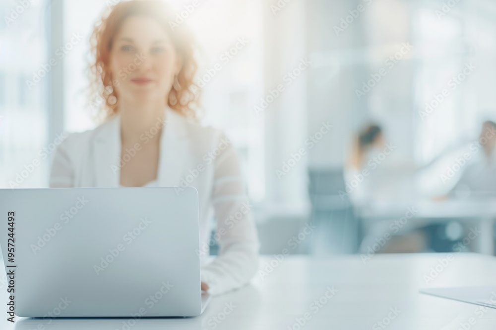 Confident Businesswoman Working on Laptop in Bright, Modern Office Setting Confident Businesswoman Working on Laptop in Bright, Modern Office Setting