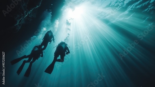 An underwater scene featuring two scuba divers exploring the depths while sunbeams pierce the water, casting dramatic and ethereal light patterns that highlight their adventure.