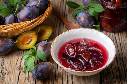 Damson plum jam and fresh plums photo