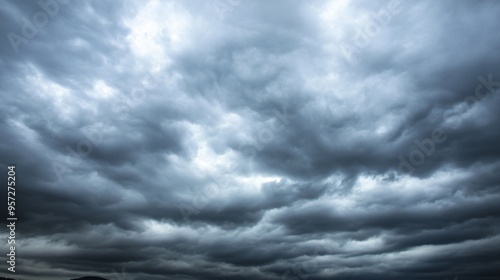 Overcast sky with dark clouds threatening rain, gloomy weather, moody atmosphere photo