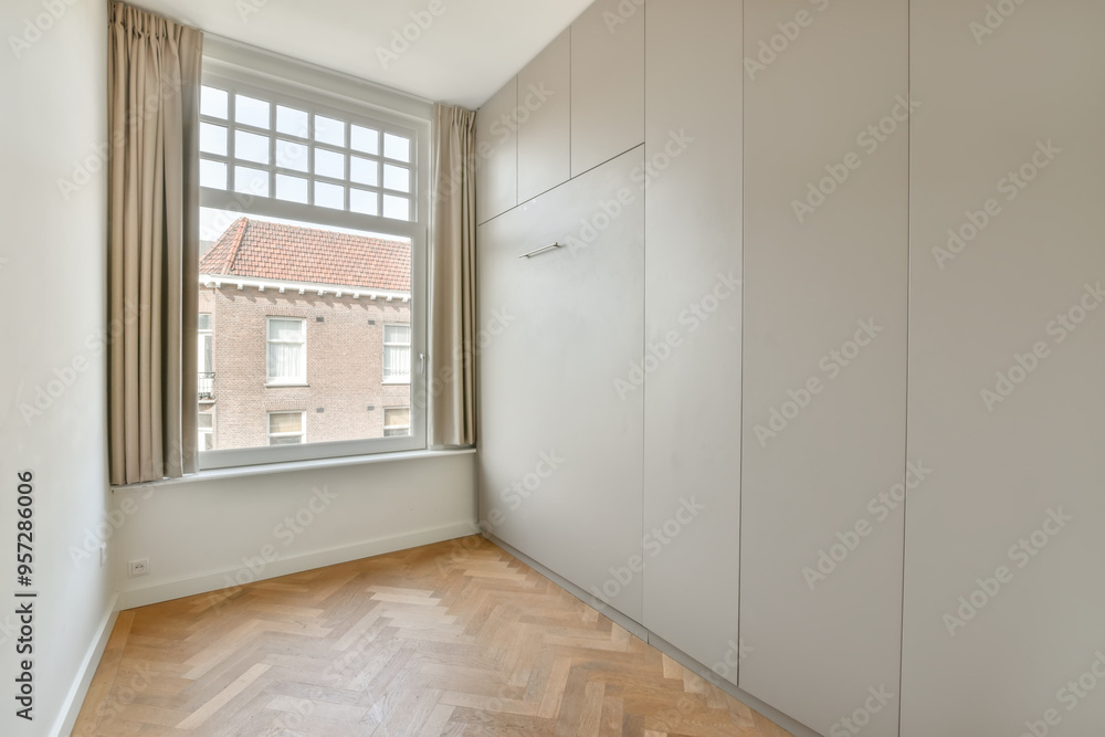 Minimalist bedroom interior with large window and wardrobe Minimalist bedroom interior with large window and wardrobe