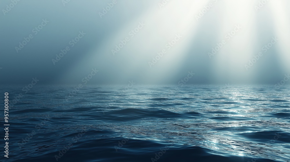 Fototapeta premium Light shafts piercing the clouds above the ocean on a stormy day