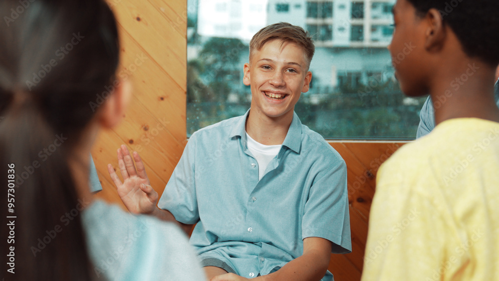 Attractive boy sharing experience during attend in group therapy. Highschool student talking about way to recovery stress while surrounded with multicultural friend listeing carefully. Edification. Attractive boy sharing experience during attend in group therapy. Highschool student talking about way to recovery stress while surrounded with multicultural friend listeing carefully. Edification.