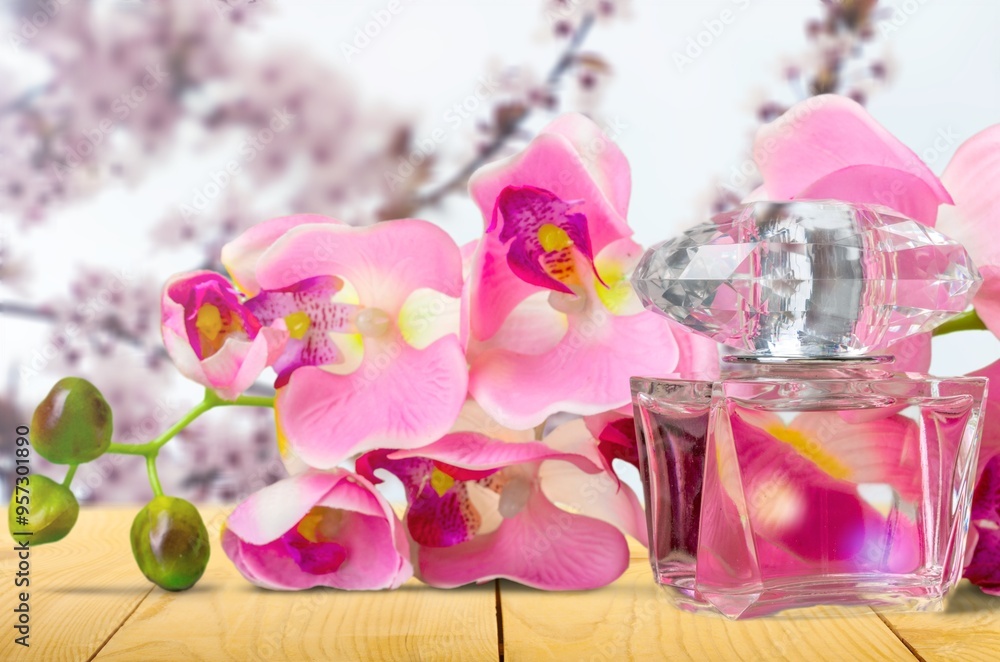Luxury perfumes with floral decor on background Luxury perfumes with floral decor on background