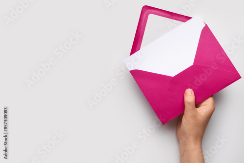 Female hand with envelope a...