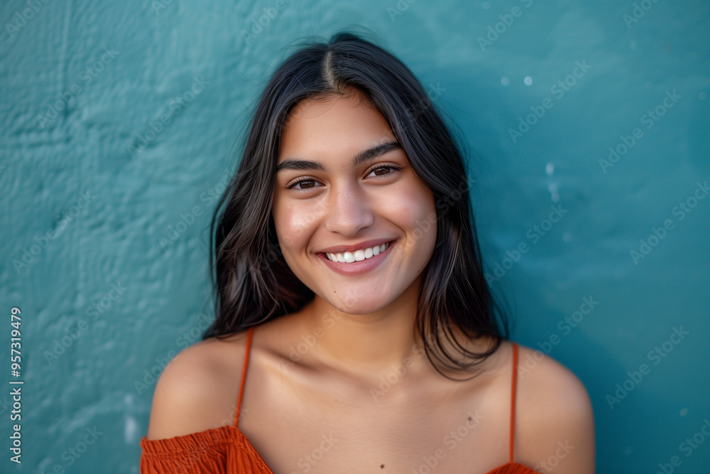 Engaged and Determined Gen Z Student: Happy Expression and Stylish Look Against a Neutral Blue Background Engaged and Determined Gen Z Student: Happy Expression and Stylish Look Against a Neutral Blue Background