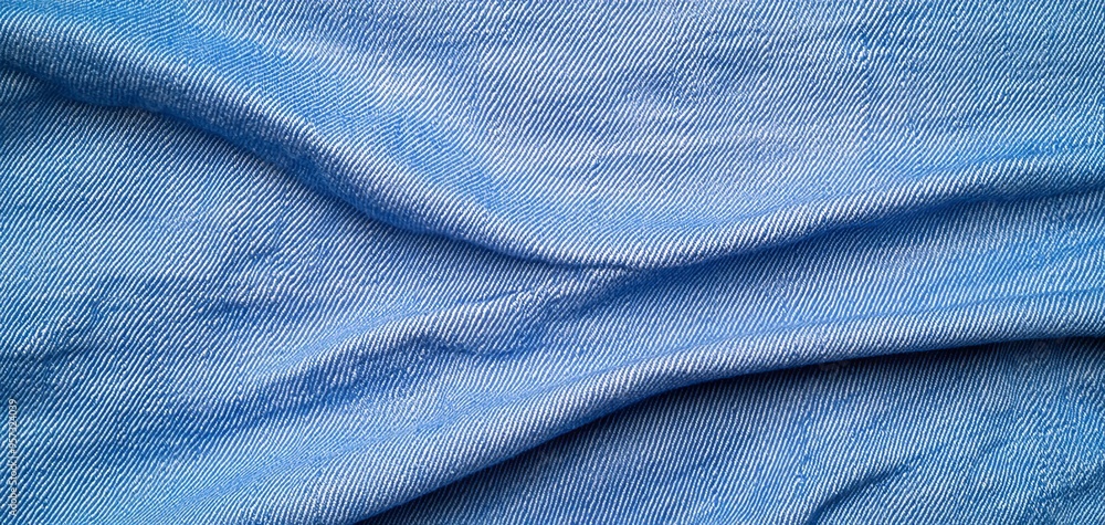 Minimalist texture of light blue denim, focusing on the clean weave and soft variations in the fabric, great for design backgrounds Minimalist texture of light blue denim, focusing on the clean weave and soft variations in the fabric, great for design backgrounds