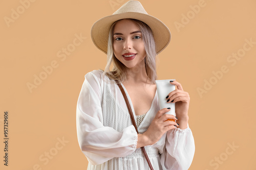 Young woman with sunscreen ...