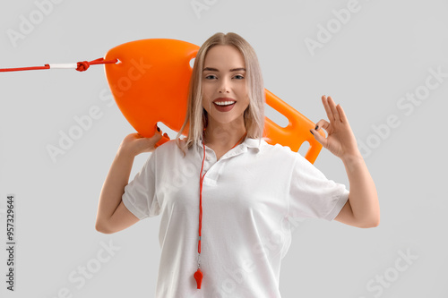 Female lifeguard with rescu...