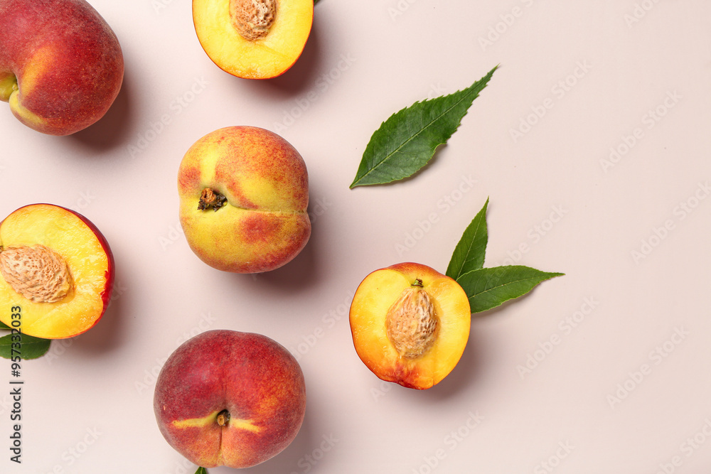Sweet peaches and leaves on beige background Sweet peaches and leaves on beige background