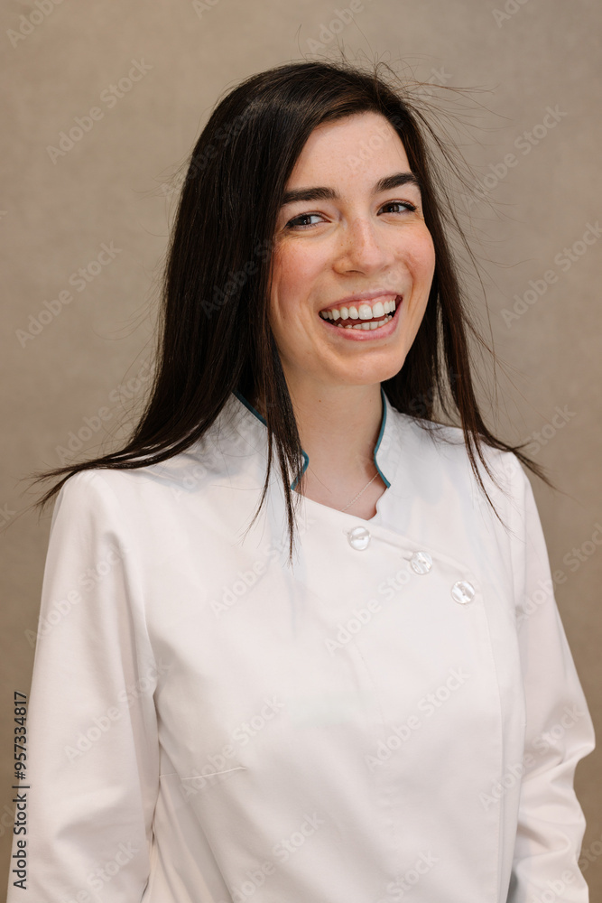 Smiling pharmacist in white coat posing for a professional portrait Smiling pharmacist in white coat posing for a professional portrait