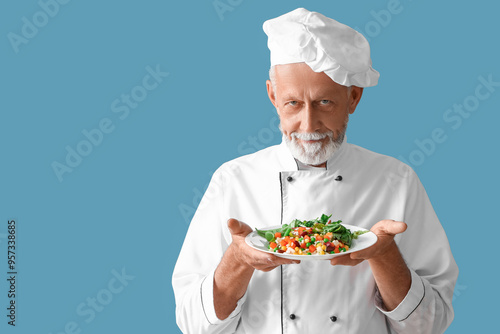 Mature chef with tasty vege...