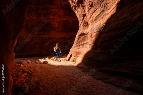 Traveler hiking Buckskin Gulch Slot Canyon photo