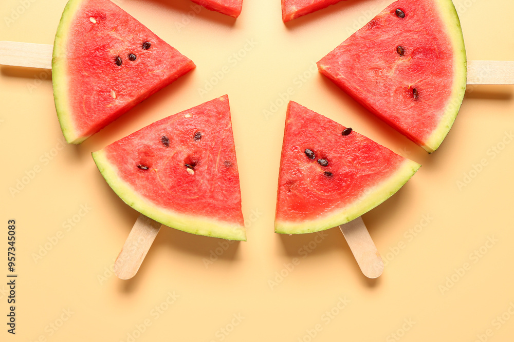 Frame made of sweet watermelon sticks on yellow background Frame made of sweet watermelon sticks on yellow background