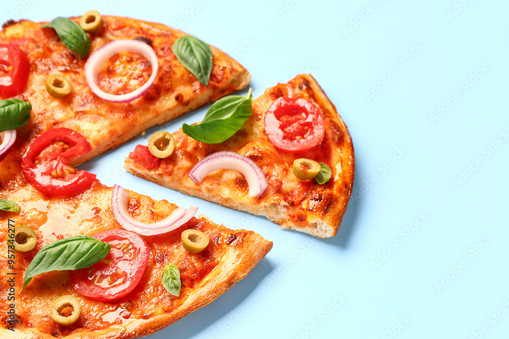 Tasty pizza with olives, tomatoes and basil on blue background Tasty pizza with olives, tomatoes and basil on blue background