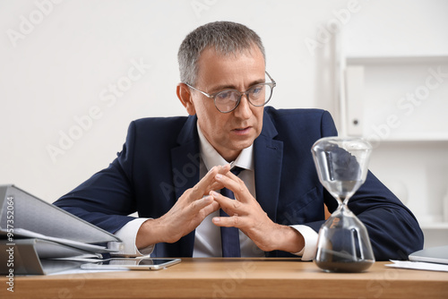 Mature businessman with hou...