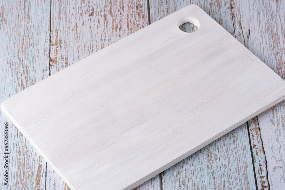 Fototapeta premium Empty cutting board on blue wooden background