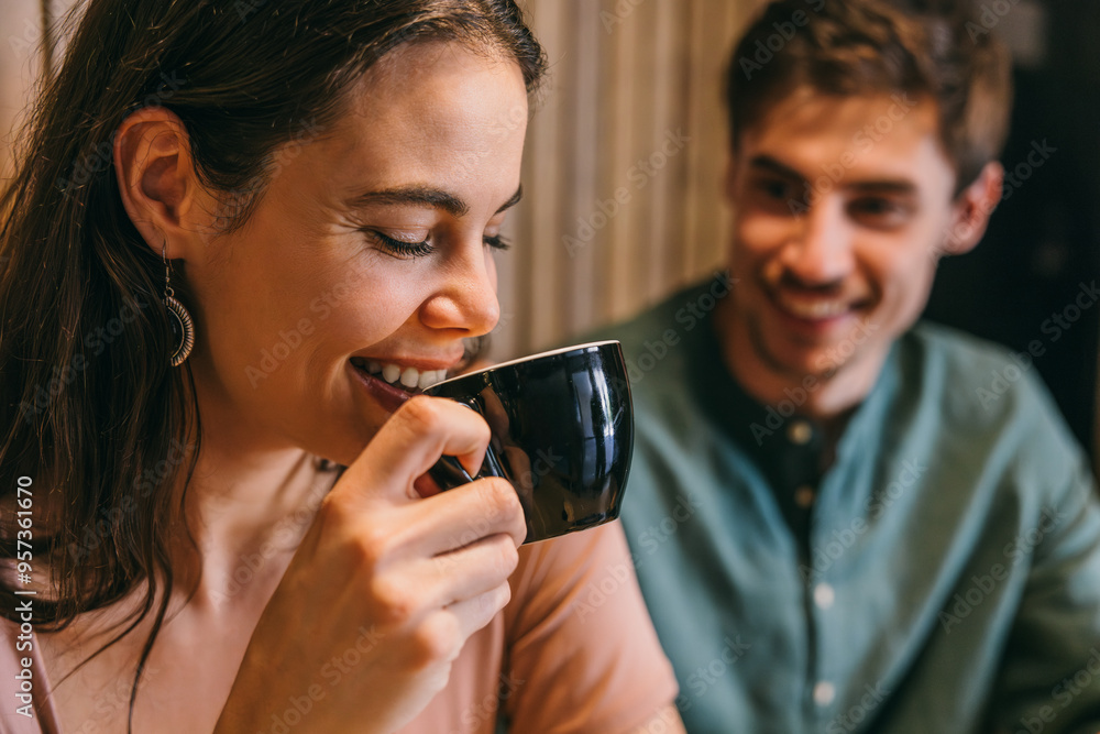 Close-up of friends sharing coffee and laughter in a cozy cafe Close-up of friends sharing coffee and laughter in a cozy cafe