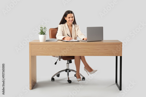 Pretty businesswoman with l...