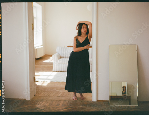 Woman In Black Dress, Doorway Reflection photo