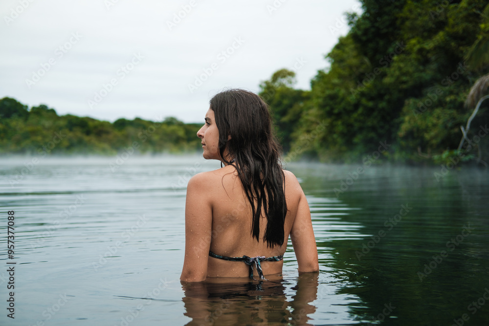 A woman bayhing in a lake A woman bayhing in a lake