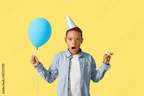 Surprised young boy in part...