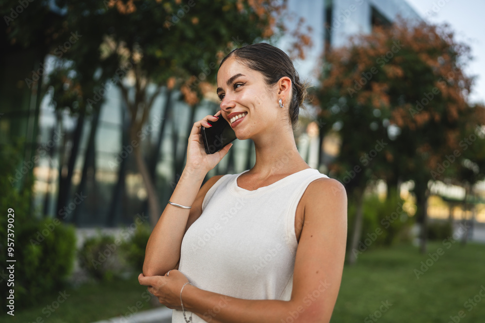 Portrait of young woman talk on mobile phone in front company outdoor Portrait of young woman talk on mobile phone in front company outdoor