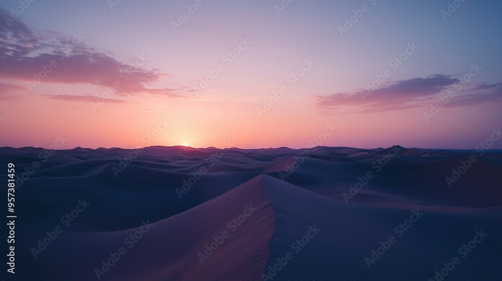 The sun sets over a desert landscape with sand dunes in the foreground and clouds in the sky The sun sets over a desert landscape with sand dunes in the foreground and clouds in the sky