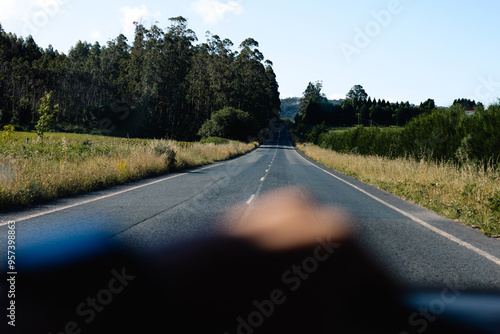 Landscape viewed from inside a car, capturing the driver's perspective photo