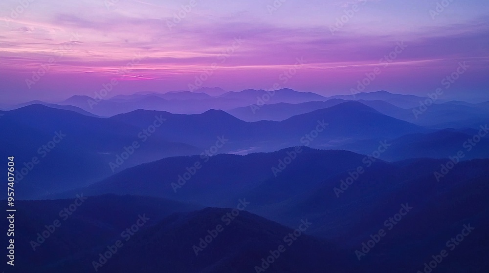 A mountain range with a pink sky in the background and foreground A mountain range with a pink sky in the background and foreground
