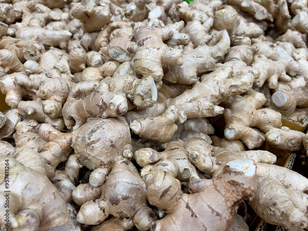 Close up of a pile of fresh ginger root for sale Close up of a pile of fresh ginger root for sale