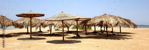 Relaxing Under Beach Umbrellas at Paradise Island in Hurghada Along the Stunning Red Sea Coast