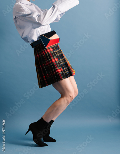 Fashionable Woman in Plaid Skirt with Trendy Belt Bag