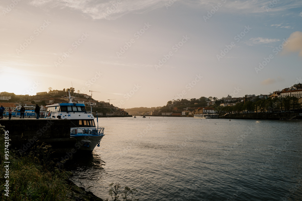 Fototapeta premium boats in the harbor of porto at sunset 