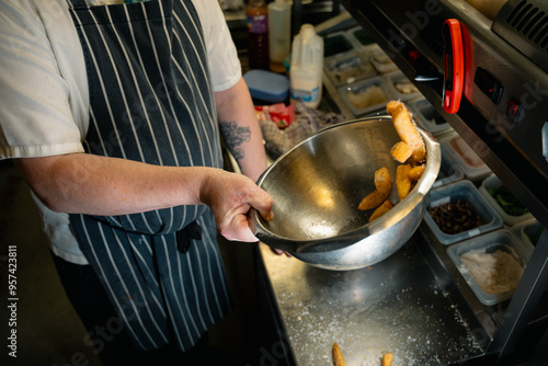 Chips Fries Being Tossed with Seasoning with motion blur