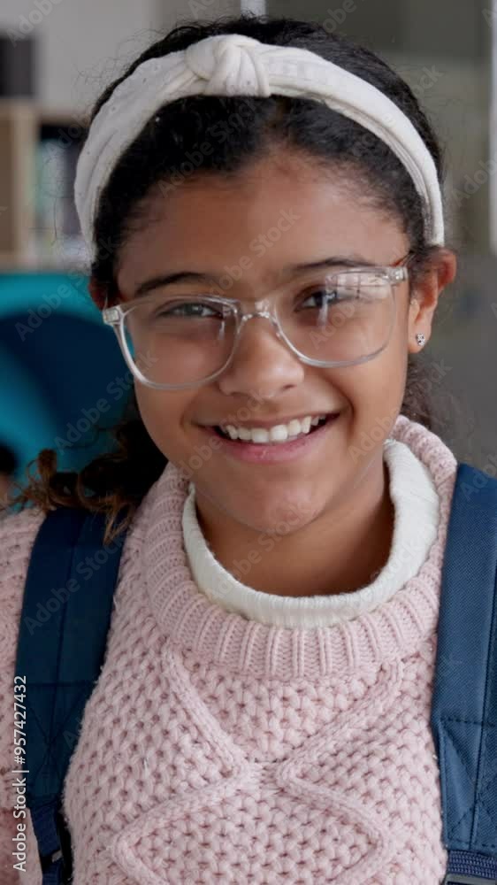 Education, child and face in classroom with glasses, backpack or smile for first day in academy. Young girl, happy or portrait in elementary school for knowledge with learning development in Colombia Education, child and face in classroom with glasses, backpack or smile for first day in academy. Young girl, happy or portrait in elementary school for knowledge with learning development in Colombia