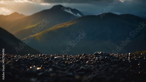 Sun Shining Through Clouds Over Mountains