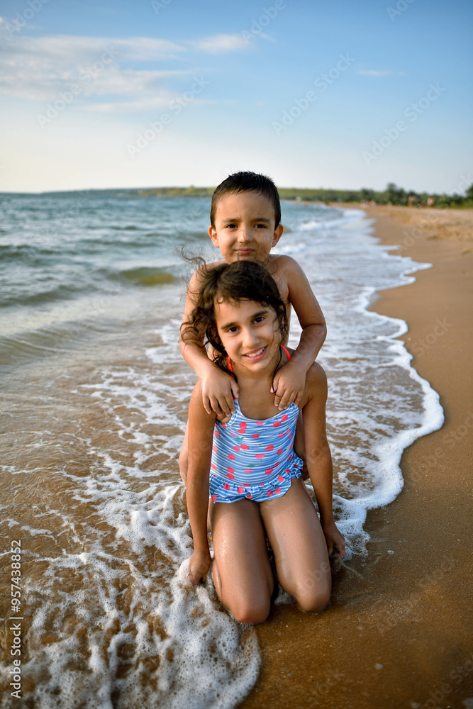 children play in the sand on the seashore children play in the sand on the seashore