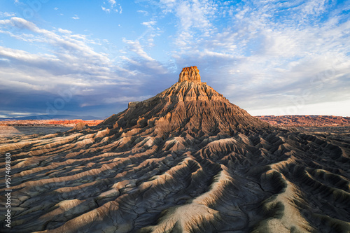 Factory Butte, massive ancient sandstone natural structure surrounding by incredible landscape .