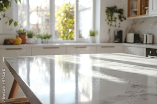 White marble countertop with sunbeams in a kitchen.