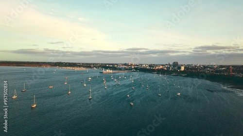 4K Drone aerial point of view over watsons bay in east Sydney, NSW, Australia with boat yacht floating in turquoise water in sunny day. Landmark famous place and water transportation concept. photo