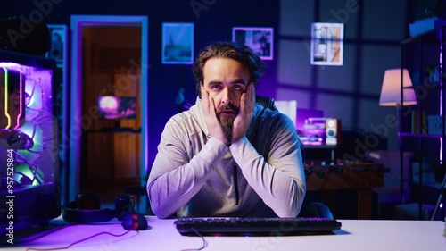 Konstfotografi Gamer unhappy with teammates performance while playing esports tournament, struggling to win