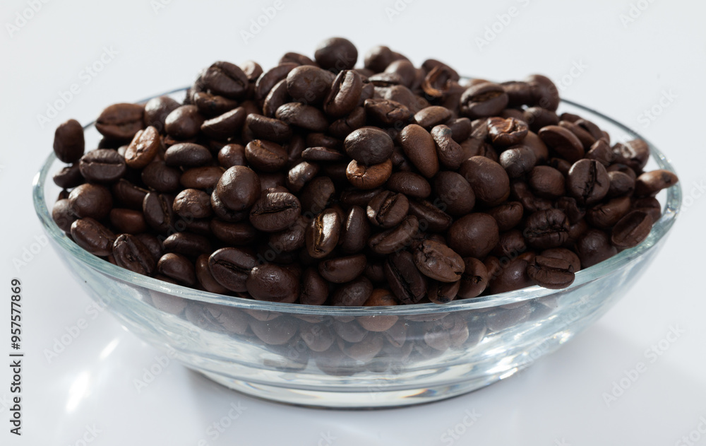 Fototapeta premium Coffee beans in a glass cup