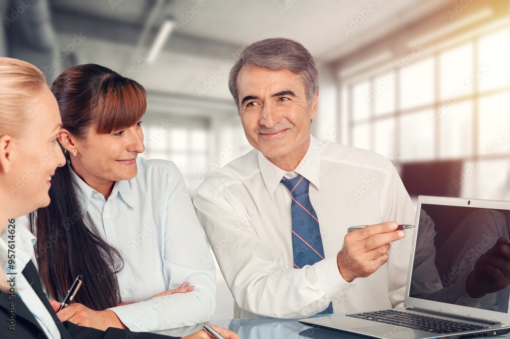 © BillionPhotos.com - Professional business people meeting in an office. © BillionPhotos.com - Professional business people meeting in an office.