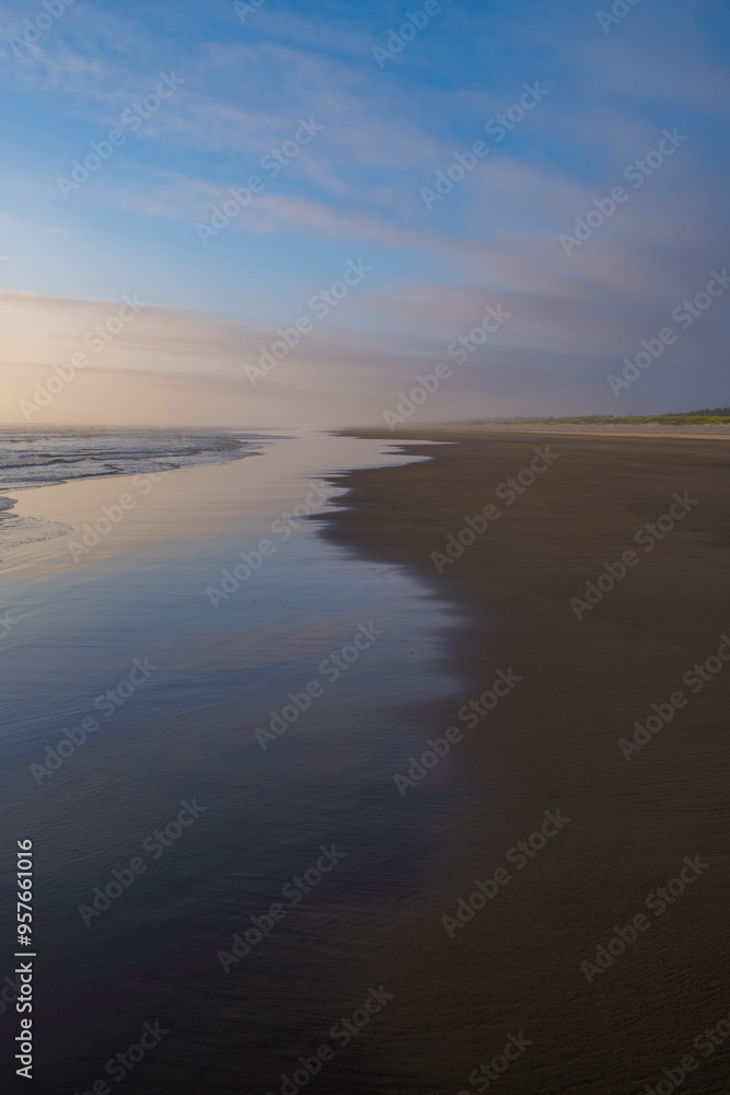 Dramatic sky over vast beach and coast Dramatic sky over vast beach and coast