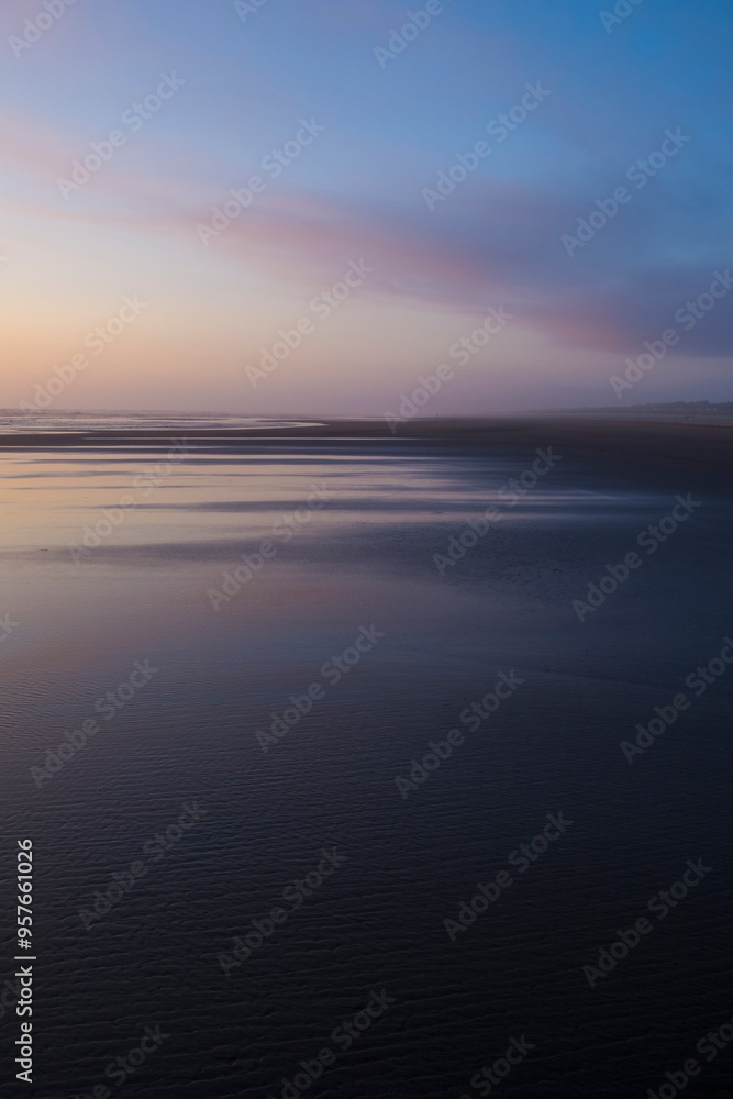 Dramatic sky over vast beach and coast Dramatic sky over vast beach and coast
