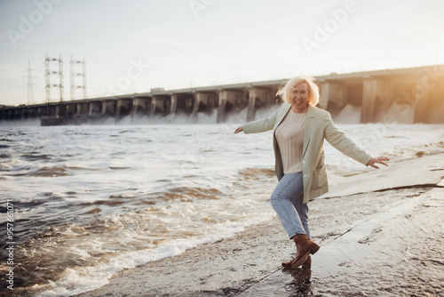 Woman Posing Playfully by the Wate photo