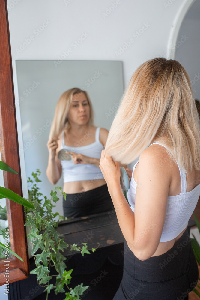 blondy woman applying serum, cream to face blondy woman applying serum, cream to face