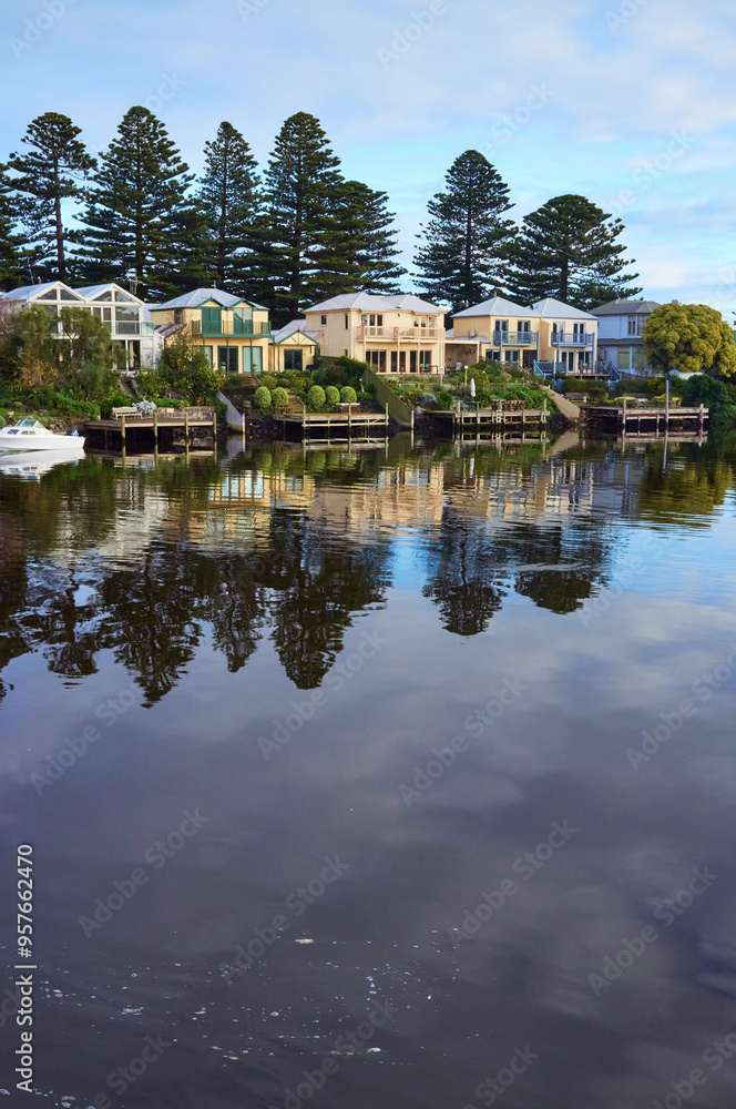 Waterfront Homes Reflecting in Calm Water Waterfront Homes Reflecting in Calm Water