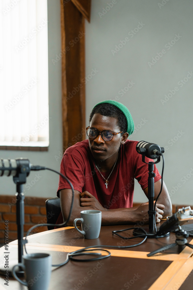 A man records a podcast A man records a podcast
